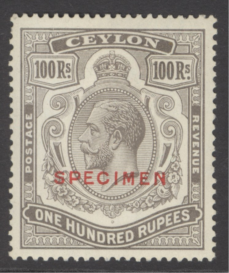 SG 359s Ceylon 1921-32. 100r brownish-grey, overprinted specimen. Lightly mounted mint & well centred