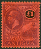 SG 61 Antigua 1921 MCA.£1 Purple and Black on Red. Lightly mounted mint CAT £250