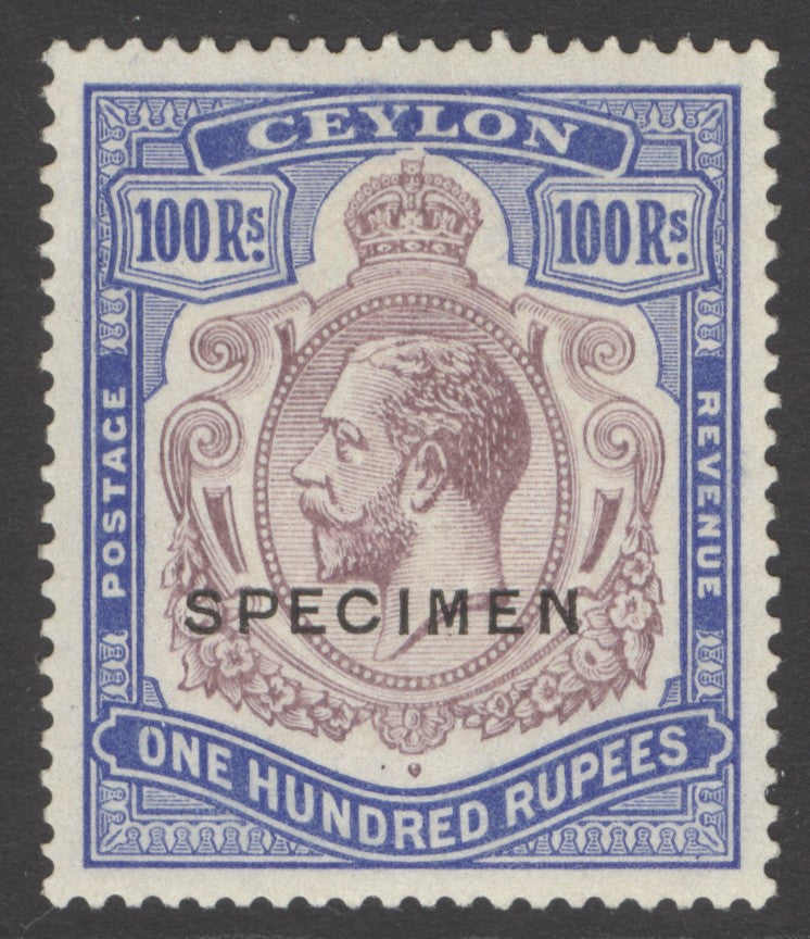 SG 360s Ceylon 1921-32. 100r dull purple-blue, overprinted specimen. A fine fresh mounted mint example. Lovely deep colour & well centred CAT £550.