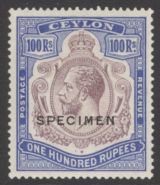 SG 360s Ceylon 1921-32. 100r dull purple-blue, overprinted specimen. A fine fresh mounted mint example. Lovely deep colour & well centred CAT £550.